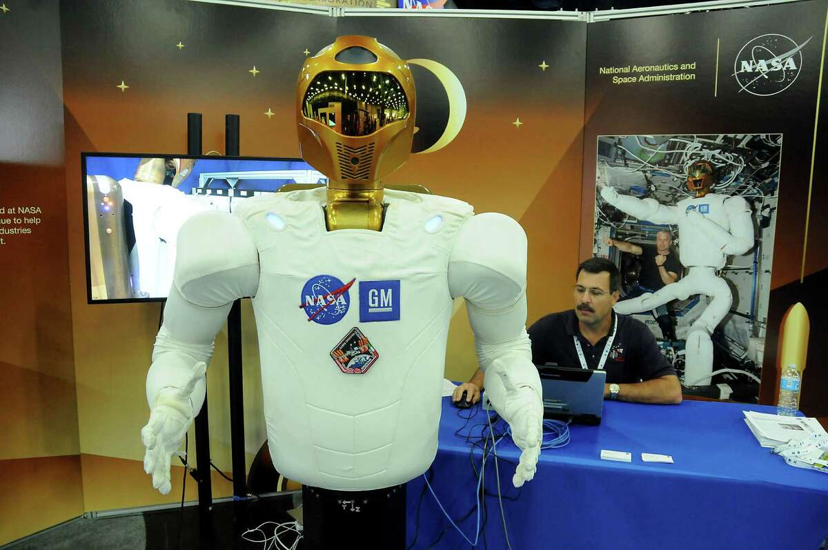 NASA's Ken Ruta controls the robonaut during a demonstration at SpaceCom at the George R. Brown Convention Center Wednesday Nov. 16, 2016.(Dave Rossman photo)