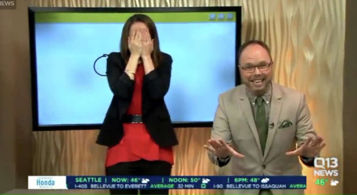 Q13 News This Morning anchor Kaci Aitchison reacts after accidentally making bathroom art during Wednesday's broadcast. Q13 digital director Travis Mayfield gets a little giddy. 