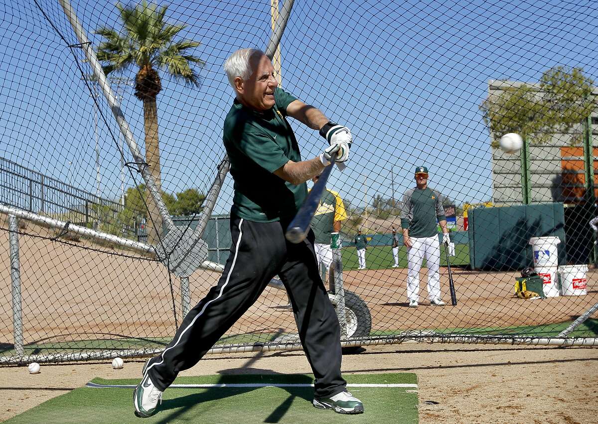 Oakland A's owner Lou Wolf takes a few swings in the batting cage, during morning workouts at Phoenix Municipal Stadium on Tuesday Mar. 12, 2013, in Phoenix, Az., as the Oakland Athletics prepare to take on the Kansas City Royals in Spring Training action.