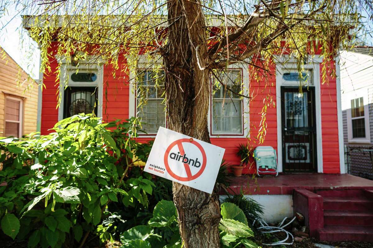 -- PHOTO MOVED IN ADVANCE AND NOT FOR USE - ONLINE OR IN PRINT - BEFORE MARCH 06, 2016. -- A sign opposing Airbnb in the front yard of a home on St. Anthony Street in the 7th Ward neighborhood, near the French Quarter in New Orleans, Feb. 7, 2016. Opponents of the rise of the short-term rentals in the city complain that the strangers squeeze out long-term residents, but supporters say renting out rooms allows them to make extra income. (William Widmer/The New York Times)