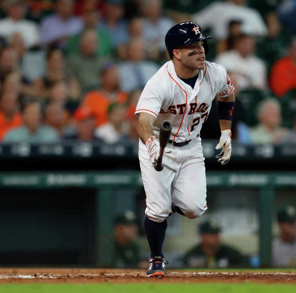 Houston Astros second baseman Jose Altuve (27) tosses his bat as he watches his ball fly out for an RBI triple, which tied the game during the eighth inning of an MLB game at Minute Maid Park, Wednesday, Aug. 31, 2016 in Houston. ( Karen Warren / Houston Chronicle )