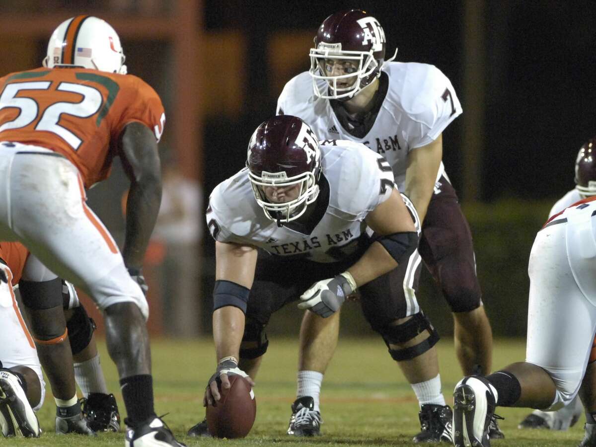 MIAMI, FL - SEPTEMBER 20: Quarterback Stephen McGee #7 of Texas A&M Aggies lines up behind center Cody Wallace #70 against the University of Miami Hurricanes at the Orange Bowl on September 20, 2007 in Miami, Florida. Miami won 31-17. (Photo by Al Messerschmidt/Getty Images)