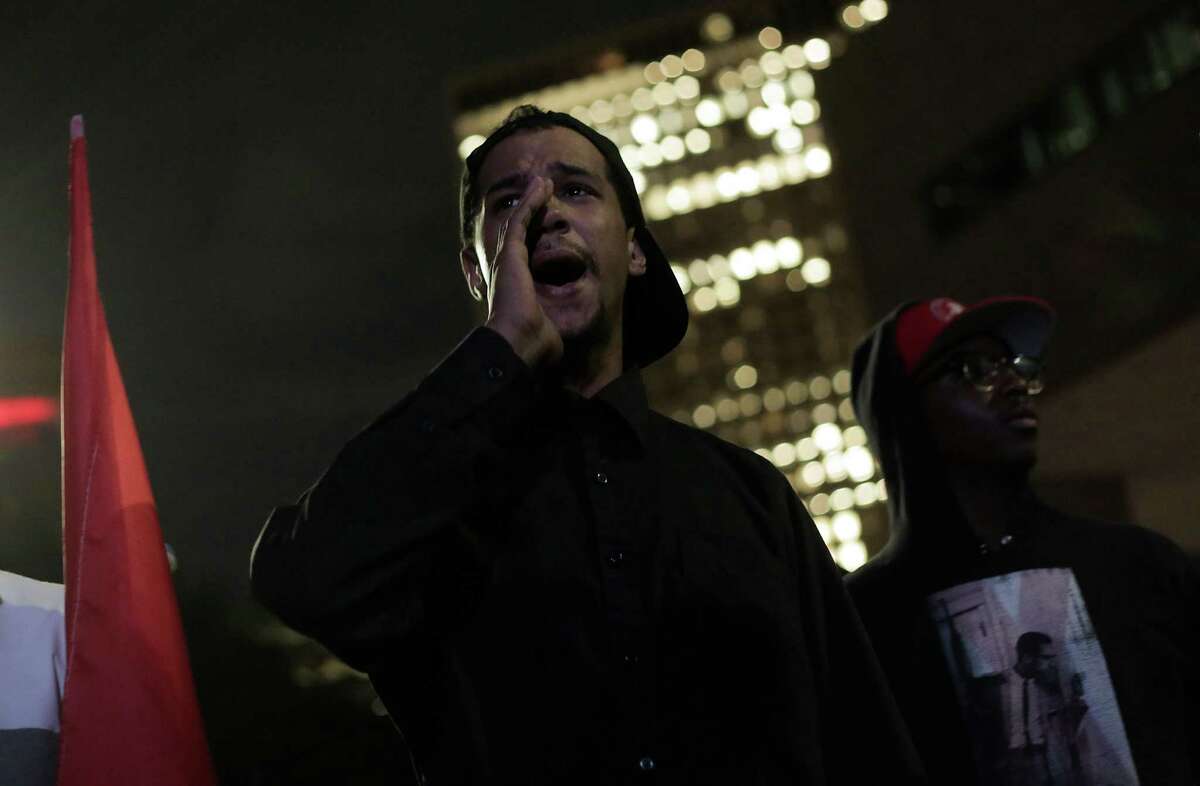 Bryan Sweeney, known as Bryan X, a local activist leader involved with the Black Panthers, shares his thoughts before protesters take to the streets Nov. 10 in downtown Houston over the election of Donald Trump as president. He was arrested later that evening in what activists say is a targeting of group leaders by police. ( Elizabeth Conley / Houston Chronicle )