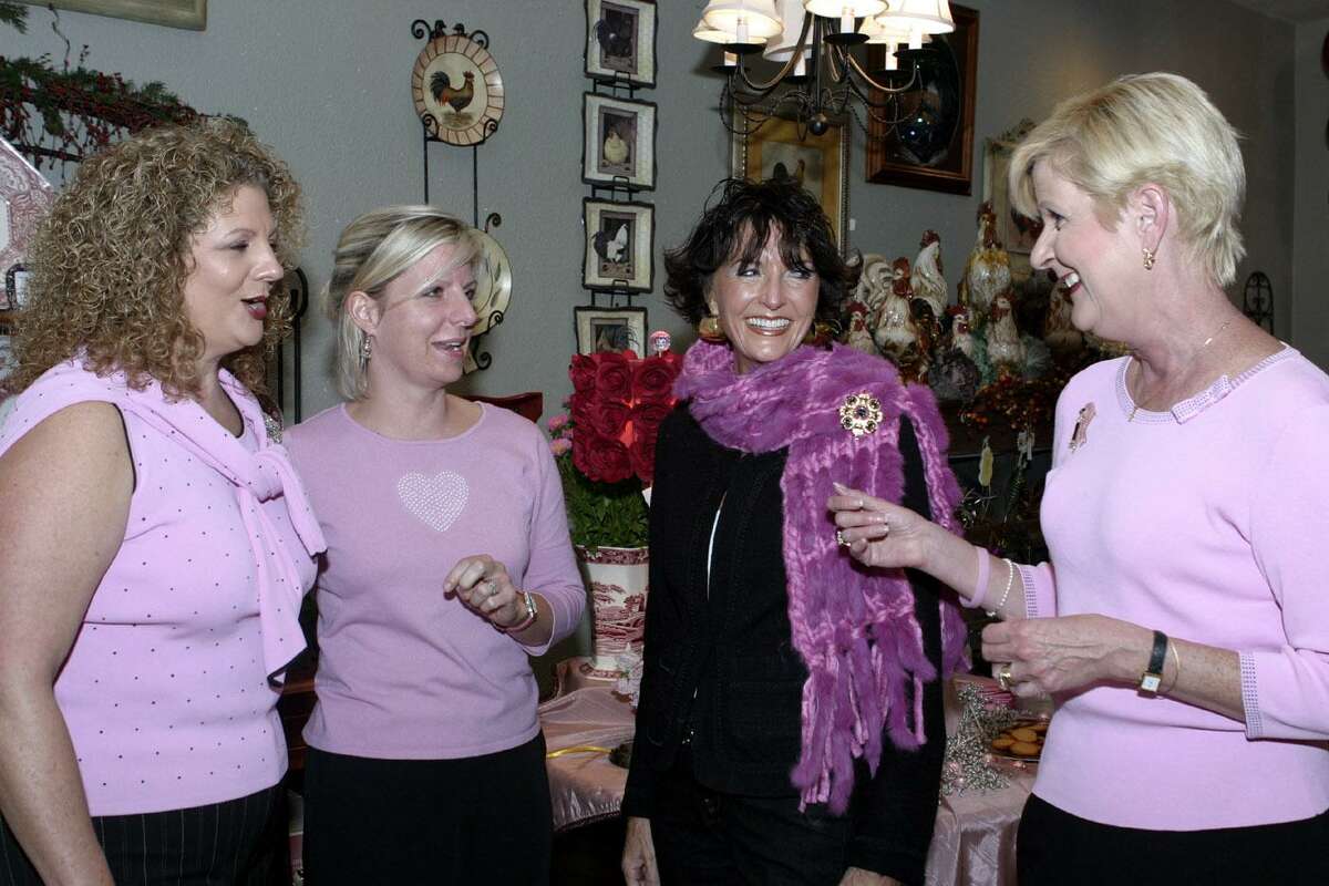 Lee Ann Elrod, left to right, Karen Bryant, Donna Muslin and Terri Jones chat at Traditions during a WINGS supporters reception in October 2004. Muslin, a legendary San Antonio fashionista and a tireless advocate for breast cancer awareness, died last week of acute leukemia.