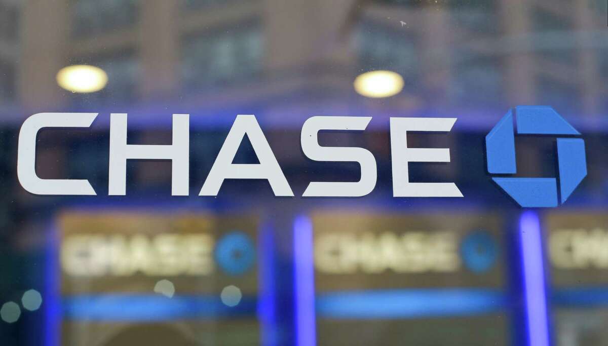 FILE - This Sept. 13, 2014, file photo, shows the Chase bank logo in New York. On Thursday, Nov. 17, 2016, JPMorgan Chase & Co., agreed to pay $264.4 million in fines to federal authorities to settle charges that it hired friends and relatives of Chinese officials in order to gain access to banking deals in that country. (AP Photo/Frank Franklin II, File)
