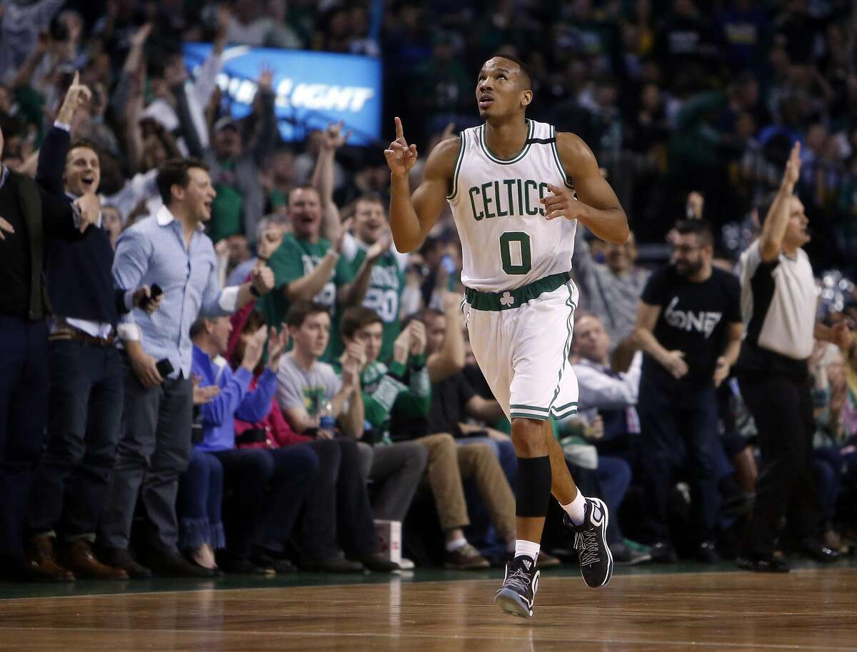 Boston Celtics' Avery Bradley celebrates a 3-pointer in 1st quarter against Golden State Warriors during NBA game at TD Garden in Boston, Massachusetts on Friday, December 11, 2015.