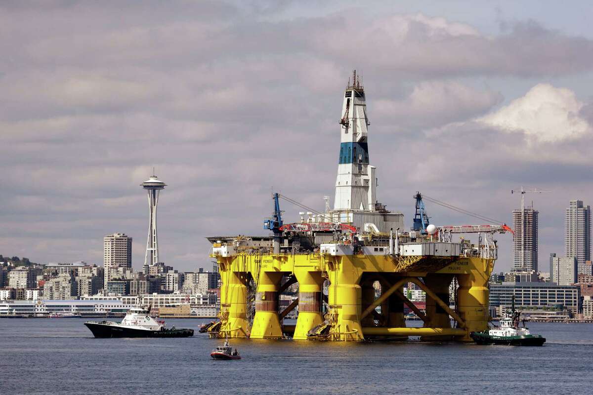 FILE - In this May 14, 2015, file photo, the Royal Dutch Shell oil drilling rig Polar Pioneer is towed toward a dock in Elliott Bay in Seattle. Three weeks after Royal Dutch Shell announced it was walking away from exploratory drilling in U.S. Arctic waters, the Obama administration has taken steps to keep drill rigs out of AlaskaÂ?’s northern ocean for a decade or more. Interior Secretary Sally Jewell announced Friday, Oct. 16, 2015, the federal government is cancelling federal petroleum lease sales in U.S. Arctic waters that were scheduled for 2016 and 2017. (AP Photo/Elaine Thompson, File)