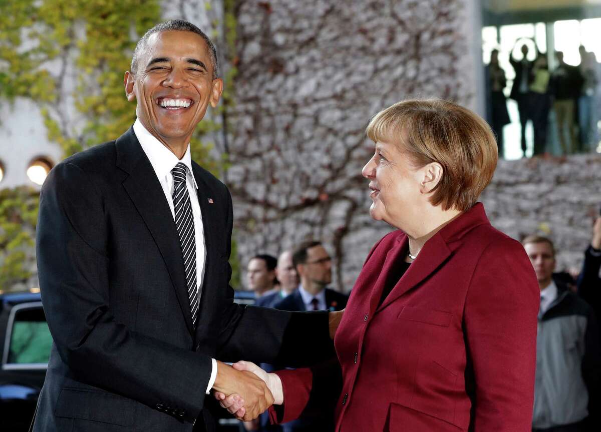 President Barack Obama is welcomed by German Chancellor Angela Merkel Friday prior to a meeting with several European leaders.﻿