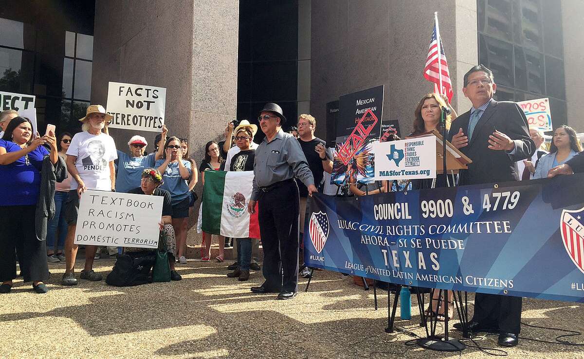 State Rep. Roberto Alonzo, D-Dallas, speaks before a crowd of about 200 people outside the Texas Education Agency's building Tuesday about why the State Board of Education should reject the Mexican American Heritage textbook.