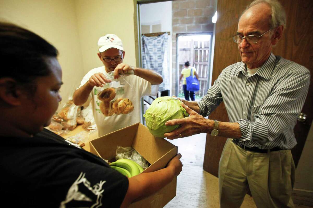 Mark Zwick, right, the founder of Casa Juan Diego, helped distribute food and find shelter for Latino families for nearly four decades. The facility now assists about 500 families a week. ﻿ ( Michael Paulsen / Houston Chronicle )