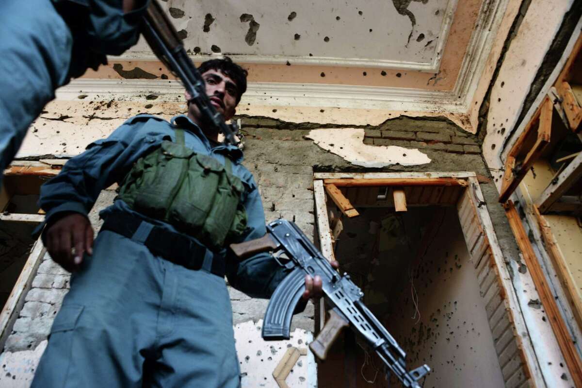 Top: Afghan security forces inspect the site of a suicide bombing that targeted a gathering of the local tribal elders in Chaparhar district of Nangarhar province on October 31, 2016. A suicide bomber detonated his explosives in a gathering of tribal elders in eastern Afghanistan, killing at least six people in the latest direct assault on civilians.† / AFP PHOTO / NOORULLAH SHIRZADANOORULLAH SHIRZADA/AFP/Getty Images