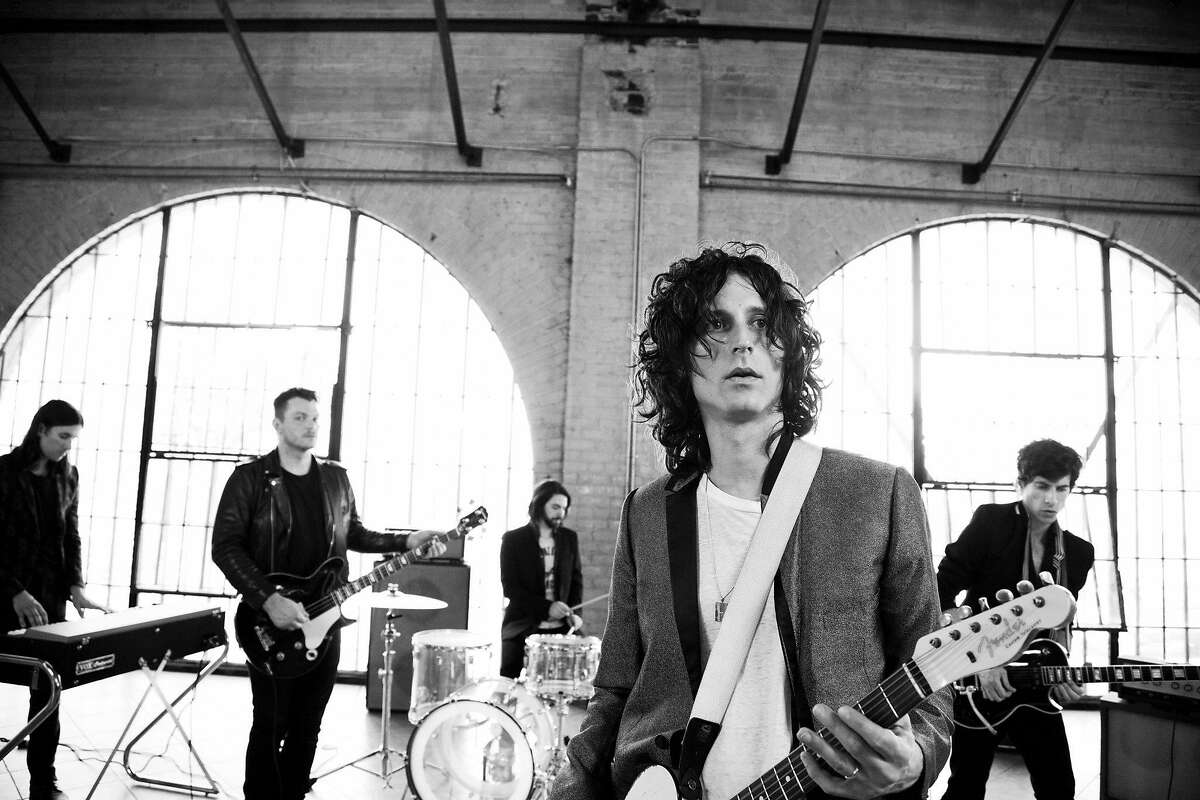 Nick Valensi (center), of the Strokes, fronts CRX