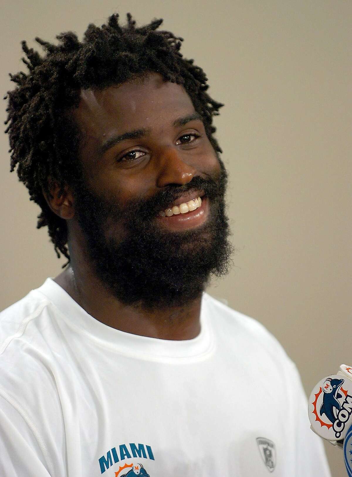 Miami Dolphins runningback Ricky Williams smiles during a news conference in this July 25, 2005 file photo in Davie, Fla. (AP Photo/Steve Mitchell)