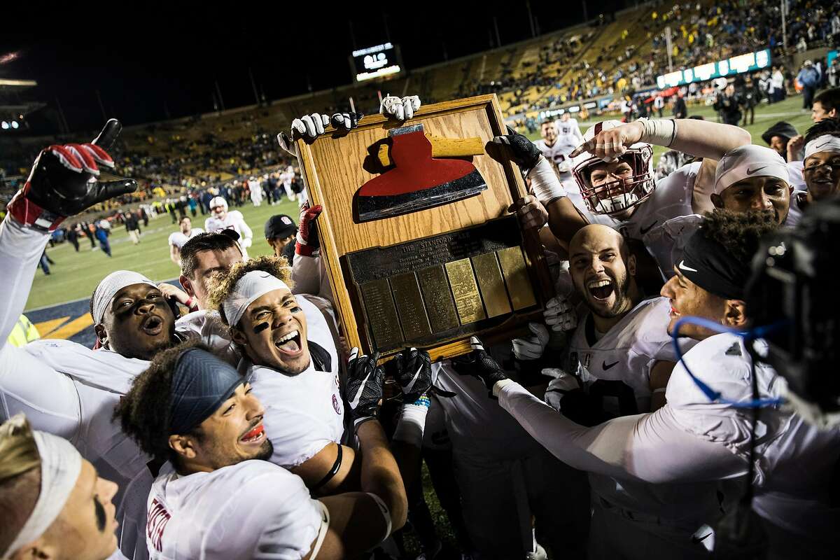 Members of the Stanford Cardinal Football team carry the Stanford Axe trophy after winning the 119th Big Game against the California Golden Bears with a score of 45-31 at Kabam Field at California Memorial Stadium in Berkeley, Calif. on Saturday, Nov. 19, 2016.