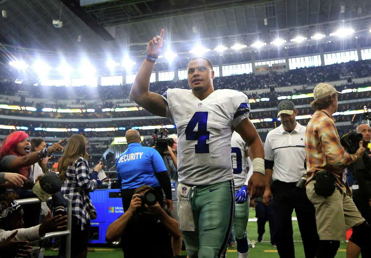 Dallas Cowboys quarterback Dak Prescott (4) acknowledges fans as he walks off the field after their NFL football game against the Baltimore Ravens on Sunday, Nov. 20, 2016, in Arlington, Texas. (AP Photo/Ron Jenkins)