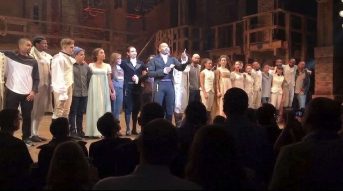 In this image made from a video provided by Hamilton LLC, actor Brandon Victor Dixon who plays Aaron Burr, the nation�s third vice president, in "Hamilton" speaks from the stage after the curtain call in New York, Friday, Nov. 18, 2016. Vice President-elect Mike Pence is the latest celebrity to attend the Broadway hit "Hamilton," but the first to get a sharp message from a cast member from the stage. (Hamilton LLC via AP)