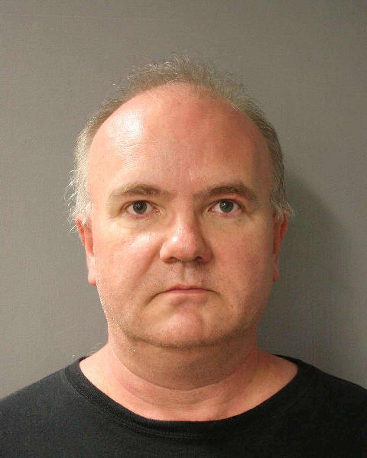 Piano teacher Dariusz Pawlas, 50, is charged with fondling a young girl in Houston. (HPD booking photo)