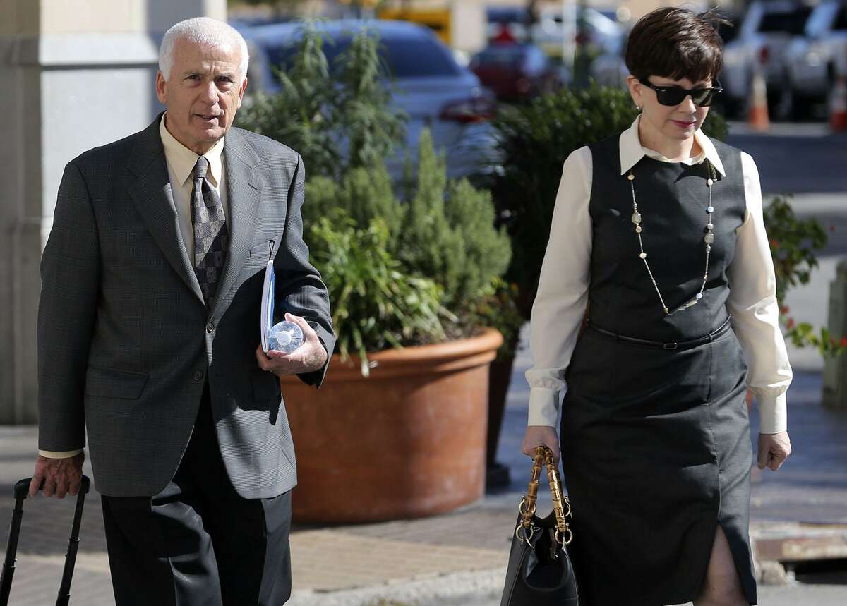 William and Karen Ozer prepare to enter the Hipolito F. Garcia Federal Building and United States Courthouse Monday. The Ozers sued San Antonio attorney Todd Prins in U.S. Bankruptcy Court, accusing him of fabricating court documents and forging judges' signatures. Prins did not appear for the hearing.
