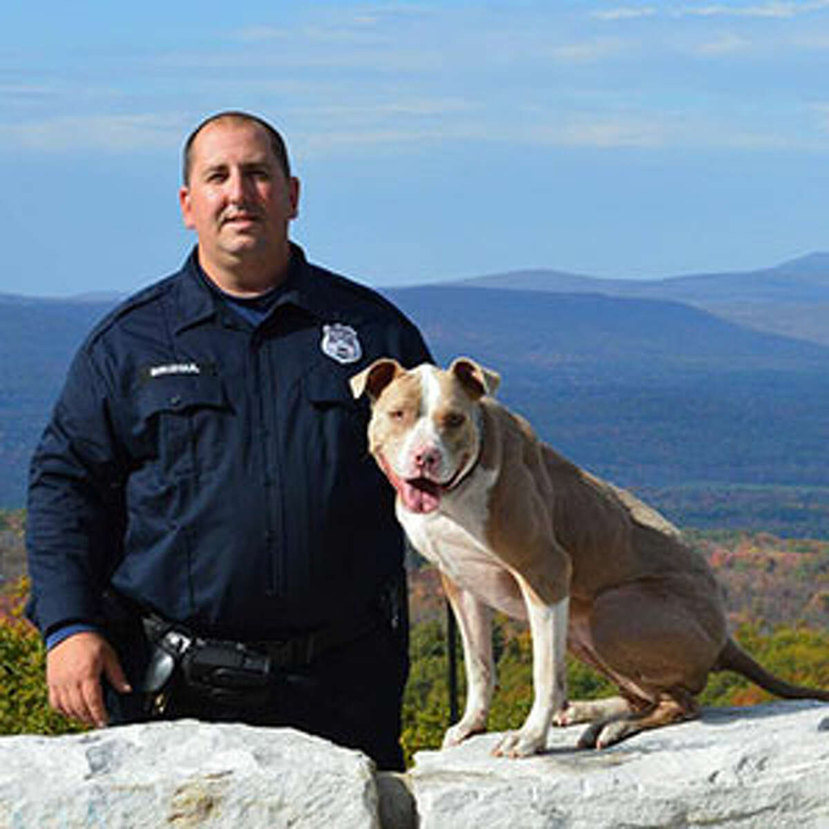 K9 Kiah poses with her handler, Poughkeepsie police Officer Justin Bruzgul. (Animal Farm Foundation)
