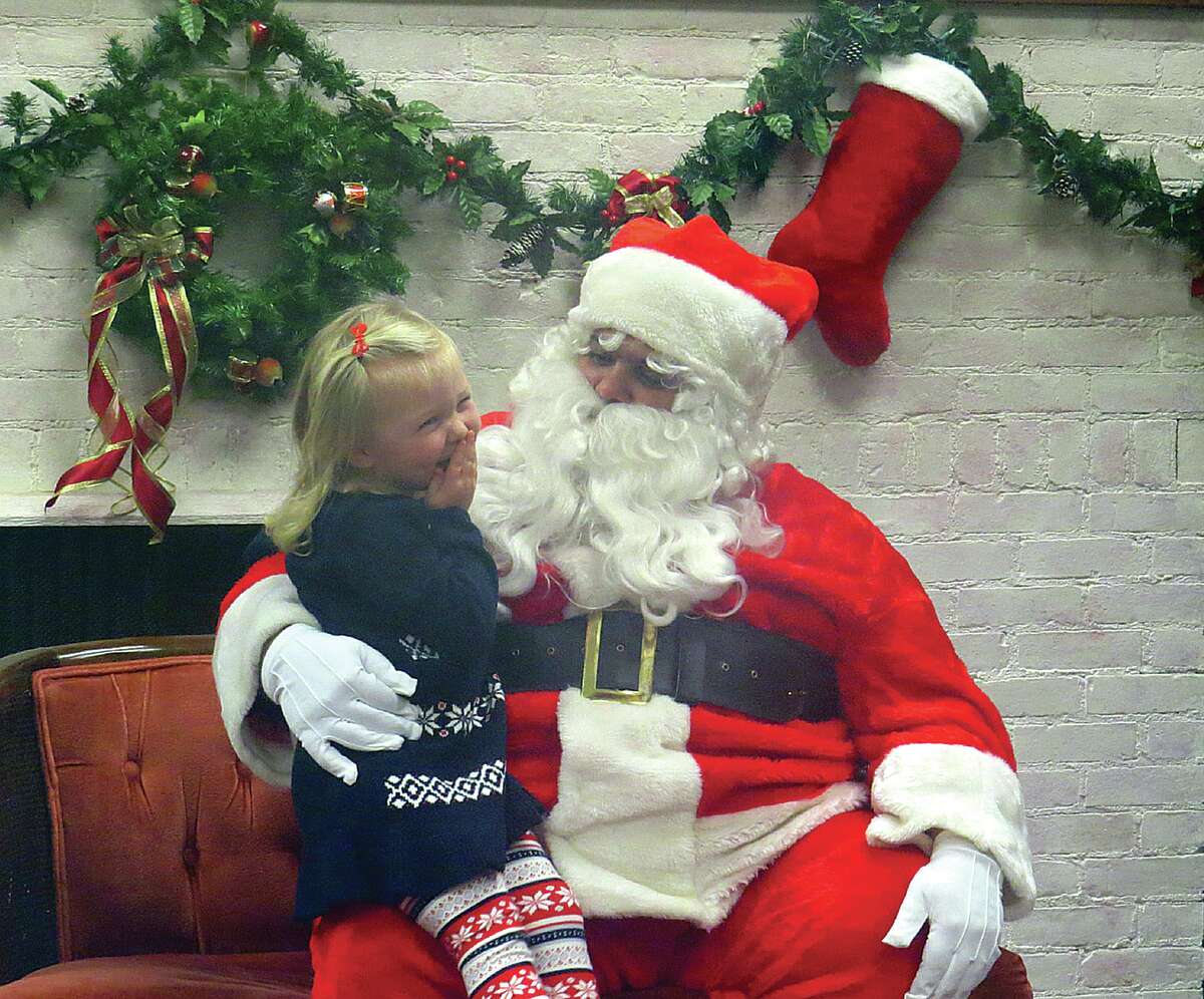 Santa enjoyed hearing children's Christmas wishes — and a few giggles in between — during Sebewaing's Christmas open house.