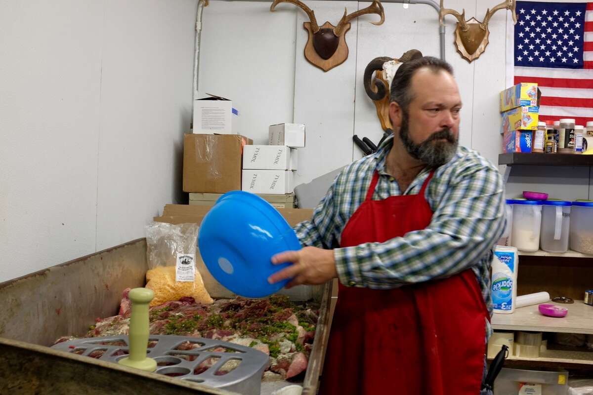 Shane Smith, whose family owns Freer Deer Camp in Freer, Texas, makes sausage. (Lydia DePillis/The Houston Chronicle)