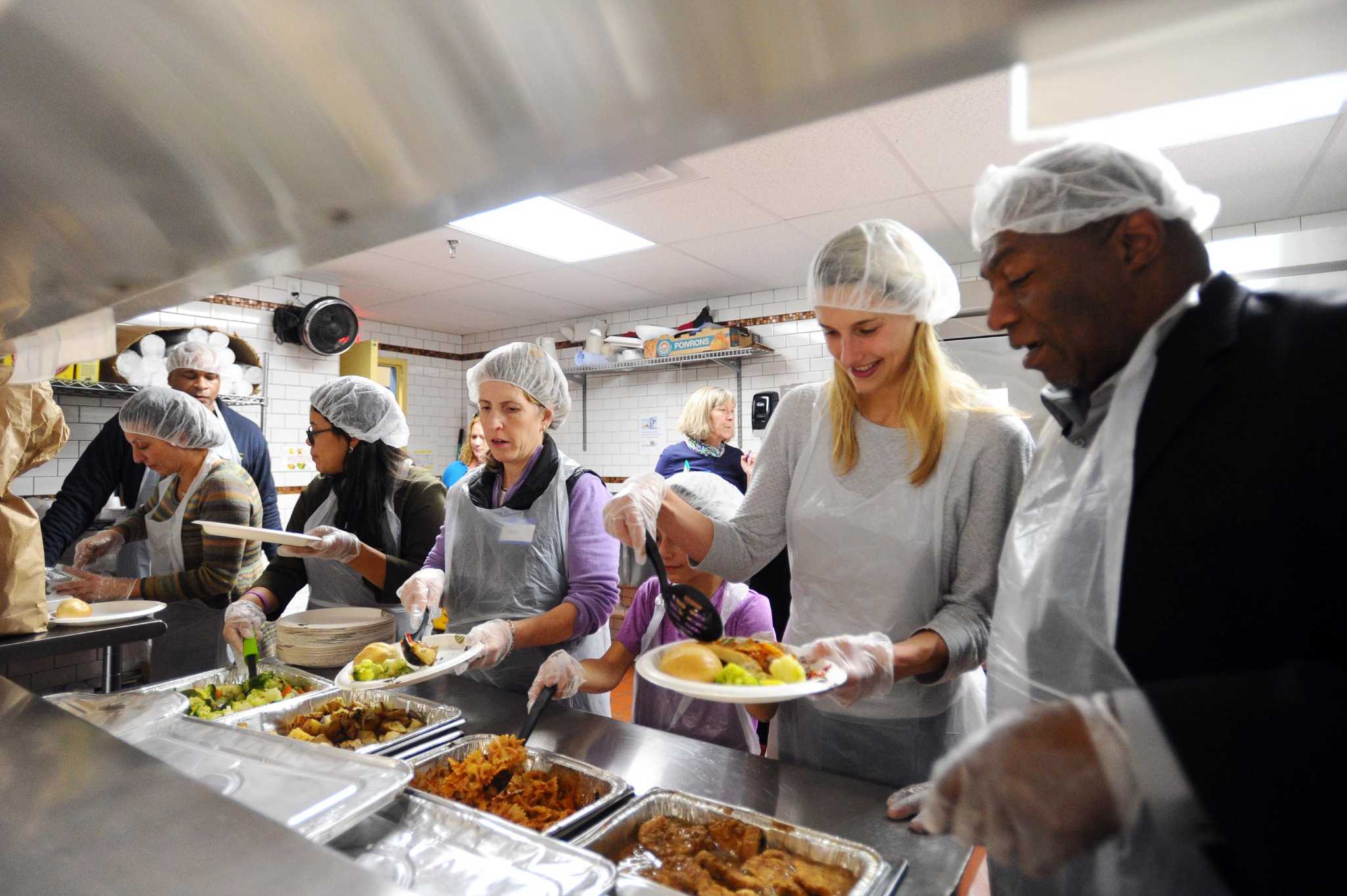 Officials serve meal at Stamford homeless shelter