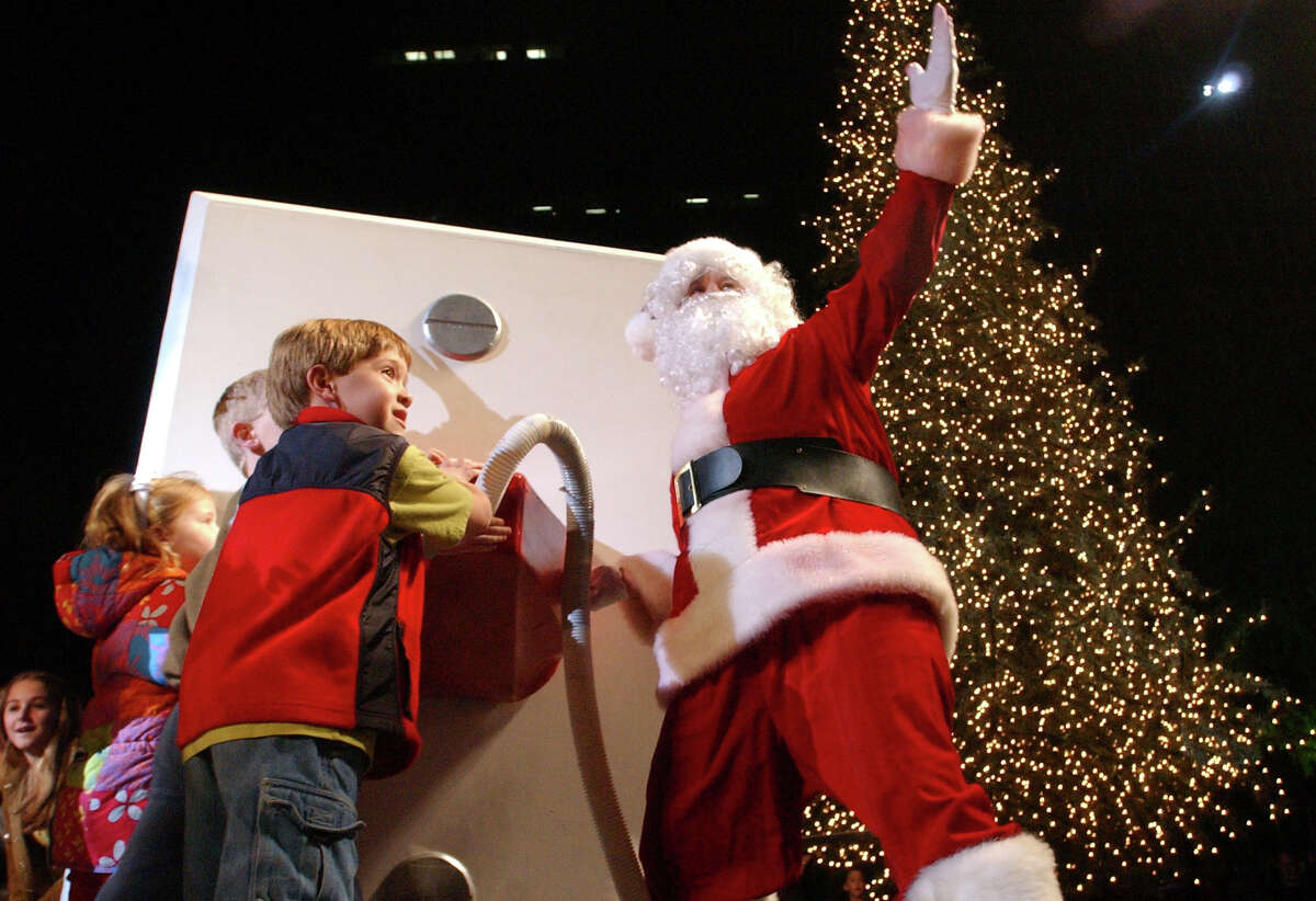 Santa Claus turns on the lights at the 17th Annual Uptown Holiday Lighting on Nov. 28, 2002. 