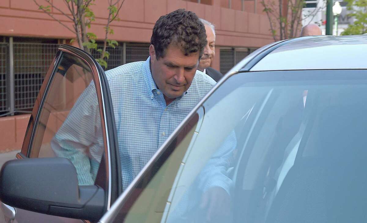 Steven Aiello, the president of COR Development, gets into an waiting car outside the Federal courthouse in Syracuse , New York, Thursday, Sept. 22, 2016. Two owners of COR Development Co., Aiello and Joseph Girardi, face federal corruption charges in U.S. Attorney Preet Bharara's investigation into economic development projects in Upstate New York. Aiello and Gerardi are accused of bribing a former top aide to Gov. Andrew Cuomo. (Dennis Nett/syracuse.com via AP)