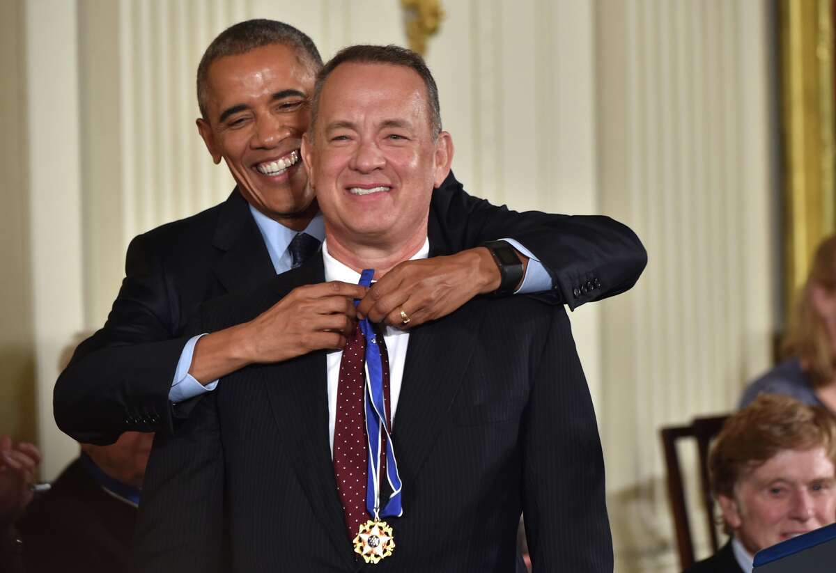 President Barack Obama presents actor Tom Hanks with the Presidential Medal of Freedom