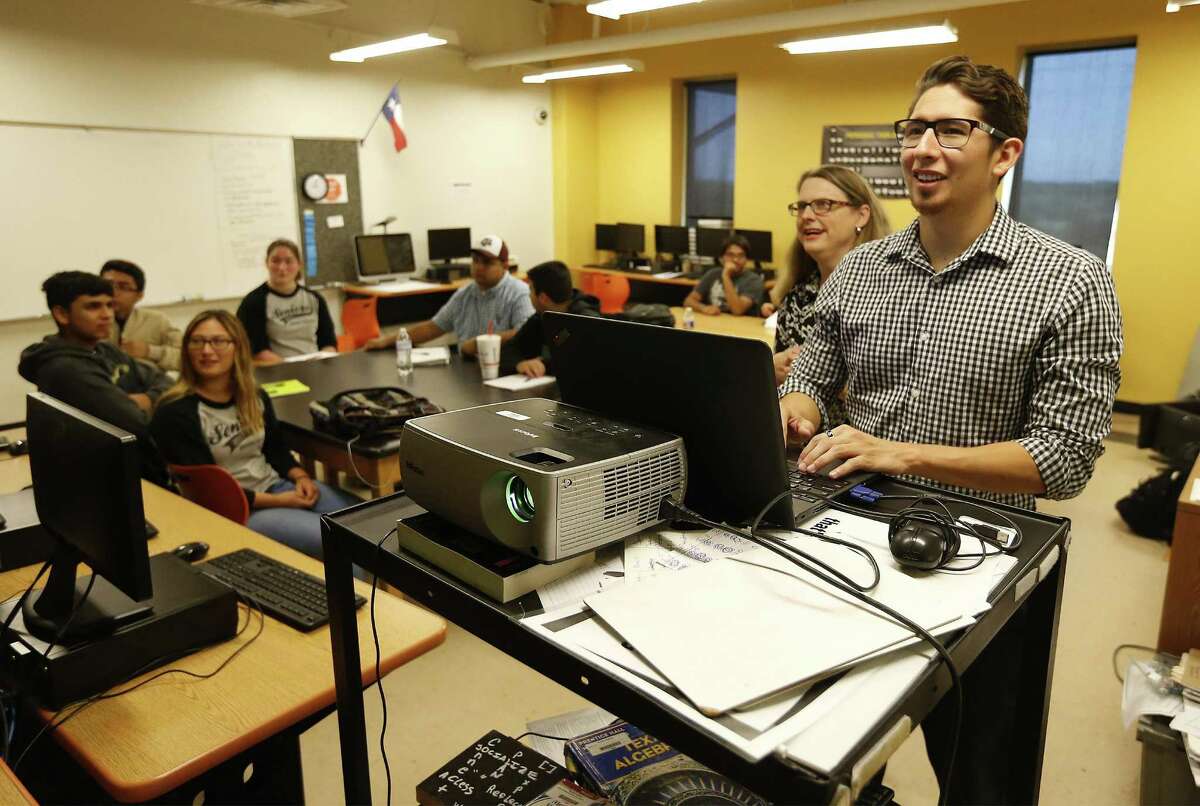 Brooks Academy of Science and Engineering (BASE) computer science teacher Trevor Desmond (right) along with National Math and Science Initiative (NMSI) study session leader Gina McCarley lead students in a Saturday study session in computer science under a new partnership between BASE and NMSI on Saturday, Nov. 12, 2016. Nine students from BASE attend the four hour study session where McCarley discussed flowcharts and algorithms along with preparing for the computer science AP exam. McCarley said the sessions are in addition designed to broaden participation for female students in areas of study such as computer science. BASE is a charter school located at Brooks City Base and teaches K thru 12th grade. They currently have over 1,500 students enrolled. (Kin Man Hui/San Antonio Express-News)