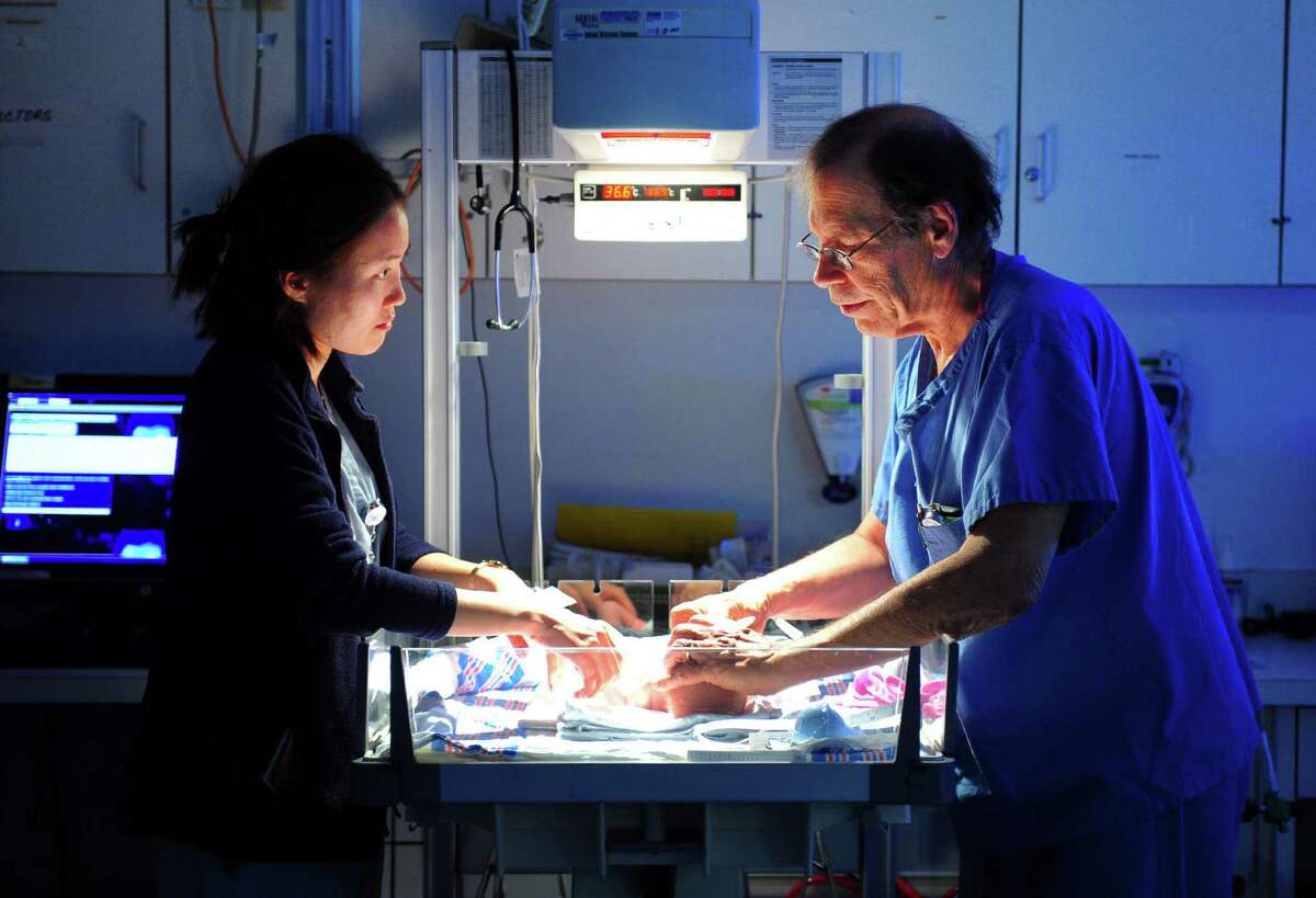 Dr. Robert Herzlinger, Director of Neonatology for Yale New Haven Children's Hospital at Bridgeport, works with third year medical student Eun Sook Choi at the hospital's NICU (neonatal intensive care unit) at Bridgeport Hospital in Bridgeport, Conn. on Tuesday Nov. 22, 2015. The Bridgeport Hospital Foundation has launched a campaign to raise the balance of $7 million to modernize the unit.