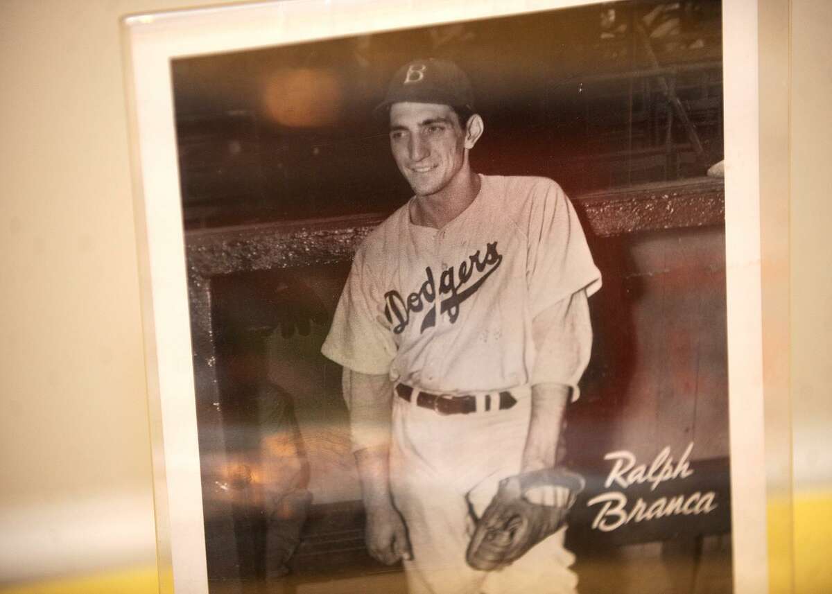 Bobby Thomson of the New York Giants hits a home run at the Polo Grounds  against the Brooklyn Dodgers in the playoff game Oct. 3, 1951. Ralph Branca  is the Dodger pitcher