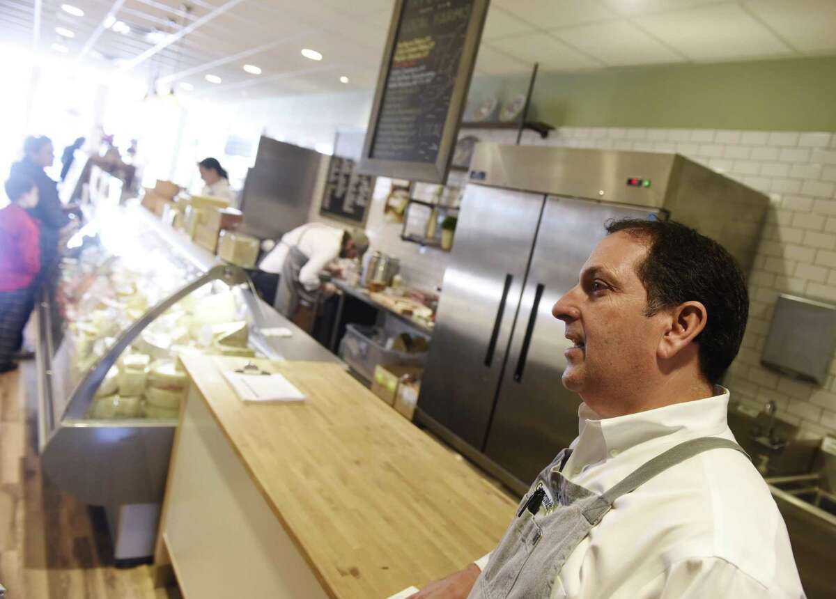 Greenwich Cheese Company co-owner Chris Palumbo speaks inside his shop in the Cos Cob section of Greenwich, Conn. Tuesday, Nov. 22, 2016. Small Business Saturday, created by American Express, is this Saturday. To encourage customers to shop locally, the Greenwich Chamber of Commerce distributed "shop local" bags to select stores.