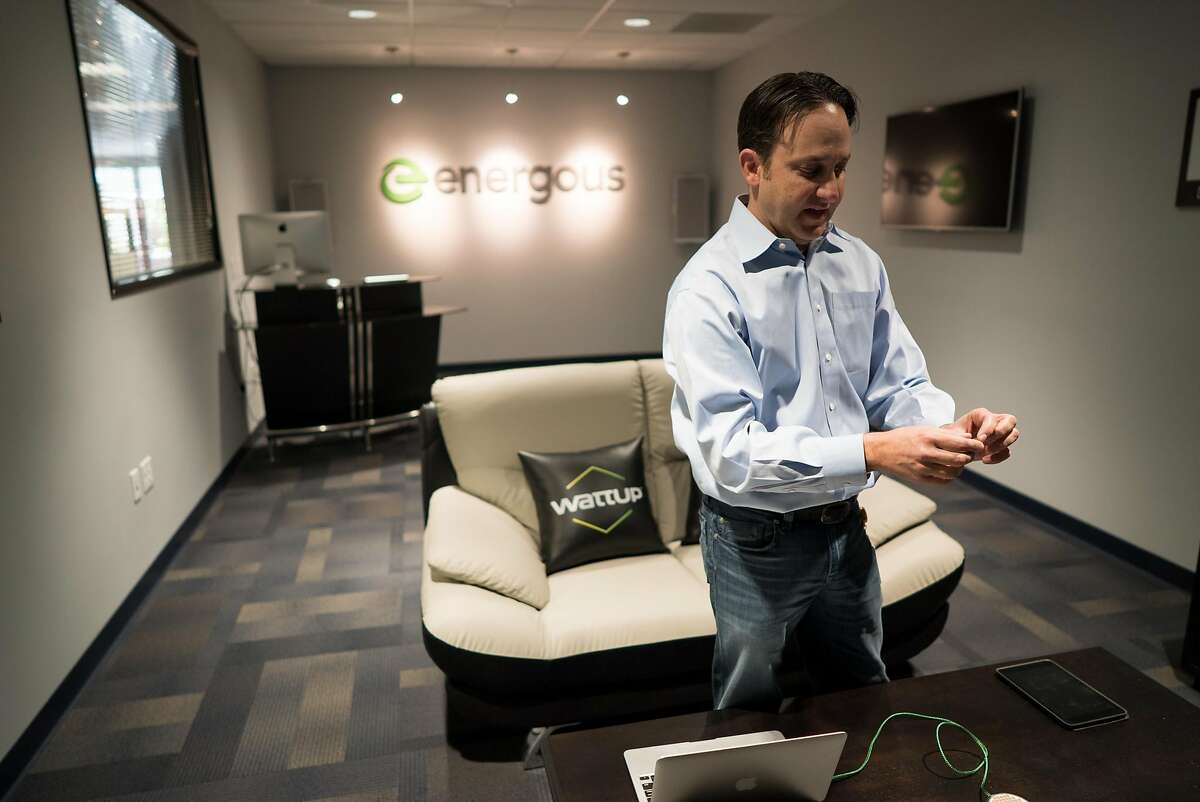 Michael Leabman demonstrates a wireless charging device at Energous in San Jose, Calif. on Thursday, Nov. 17, 2016. Marty Cooper was previously an engineer at Motorola and made the world's first cell phone call.