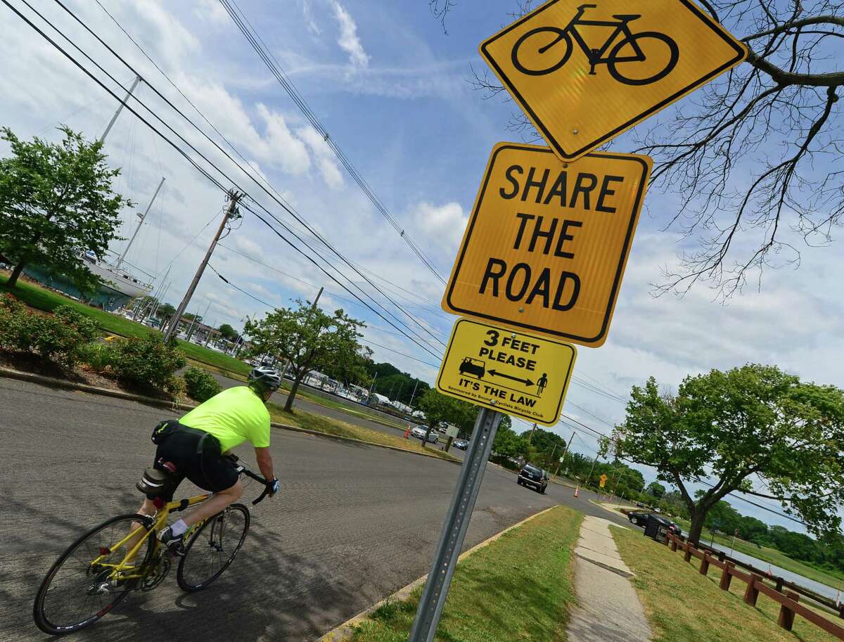 A bicyclist pedals down Calf Pasture Beach Road in Norwalk, Conn. Saturday July 2, 2016. Norwalk Department of Public Works evaluating bicycle lanes request for Water Street, between Washington and Burritt streets; Calf Pasture Beach Road, from Gregory Boulevard to Shorehaven Road; Gregory Boulevard, from East Avenue to Calf Pasture Beach Road; and County Street, from Westport Avenue to the town line.
