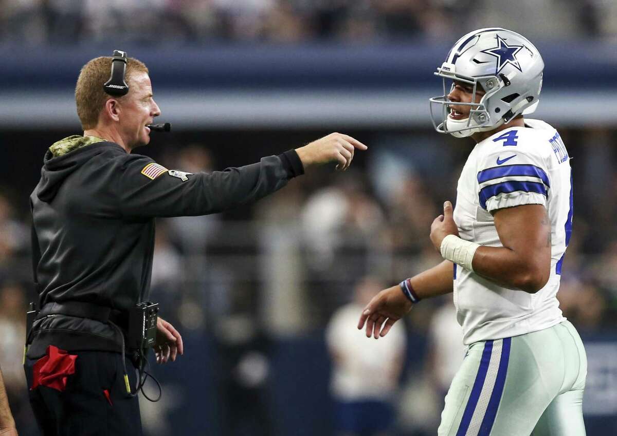 Dallas Cowboys head coach Jason Garrett talks to quarterback Dak Prescott (4) during a game against the Baltimore Ravens on Nov. 20, 2016 at AT&T Stadium in Arlington.