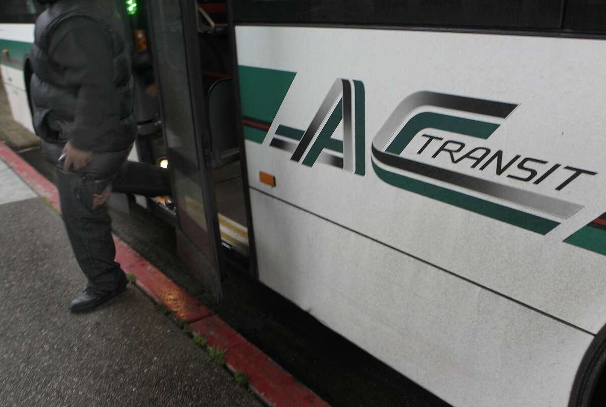 A passenger hops off an AC Transit bus at the MacArthur BART station in Oakland, Calif. on Tuesday, June 25, 2013. Employees from both transit agencies could walk off the job this weekend, creating a commute nightmare if they don't reach an agreement in contract talks with management negotiators.