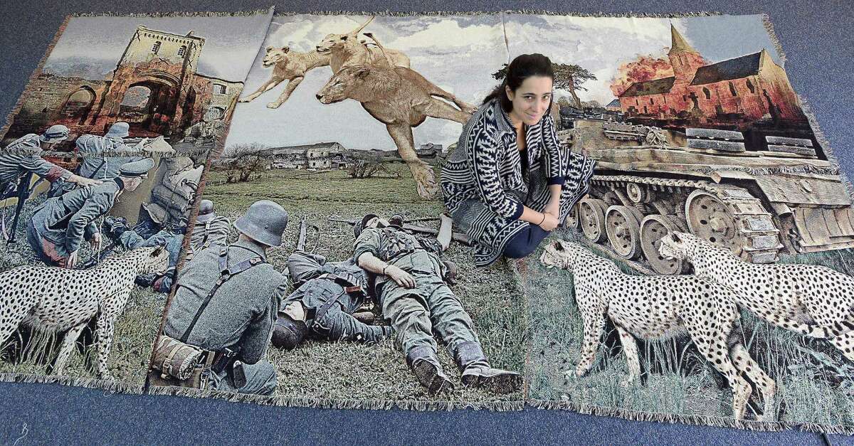 Rose DeSiano, an artist/photographer whose exhibit "War Tapestries" will be on display at the UConn Stamford Art Gallery. Rose is photographed on Nov. 11, 2016 as she installs a series of photograph re-enactments of famous war scenes for her series of images that she displays through tapestries as a canvas.