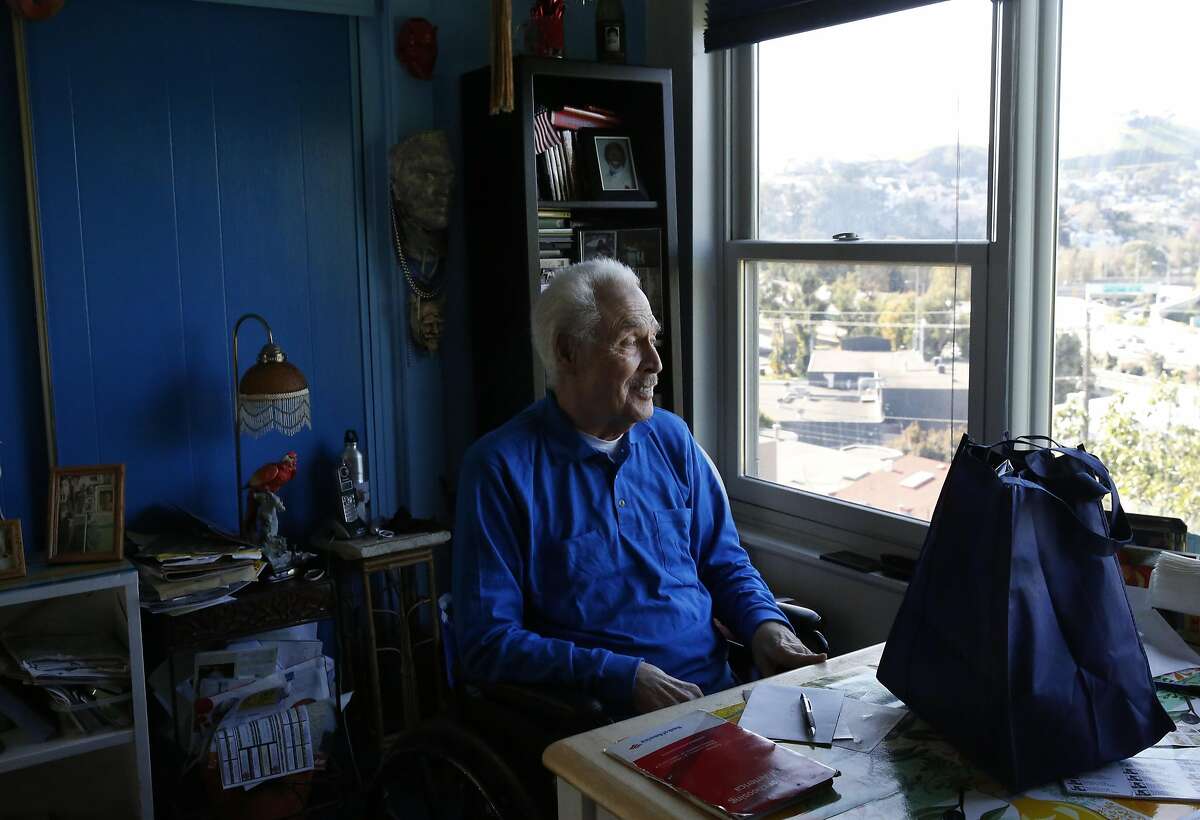 Bernie, 90, who preferred to only give his first name, looks out through his window as his Meals on Wheels delivery sits on the table in front of him in his home Nov. 24, 2016 in San Francisco, Calif.