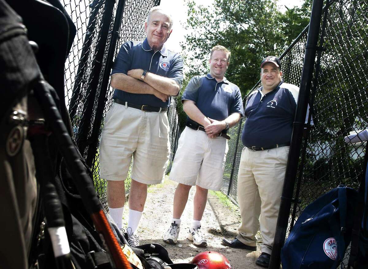 Stamford_071109_ (L to R) Larry Miller and his sons, Scott Miller and Russ Miller at the Stamford American Little League field on Vine Rd. Kathleen O'Rourke/Staff photo