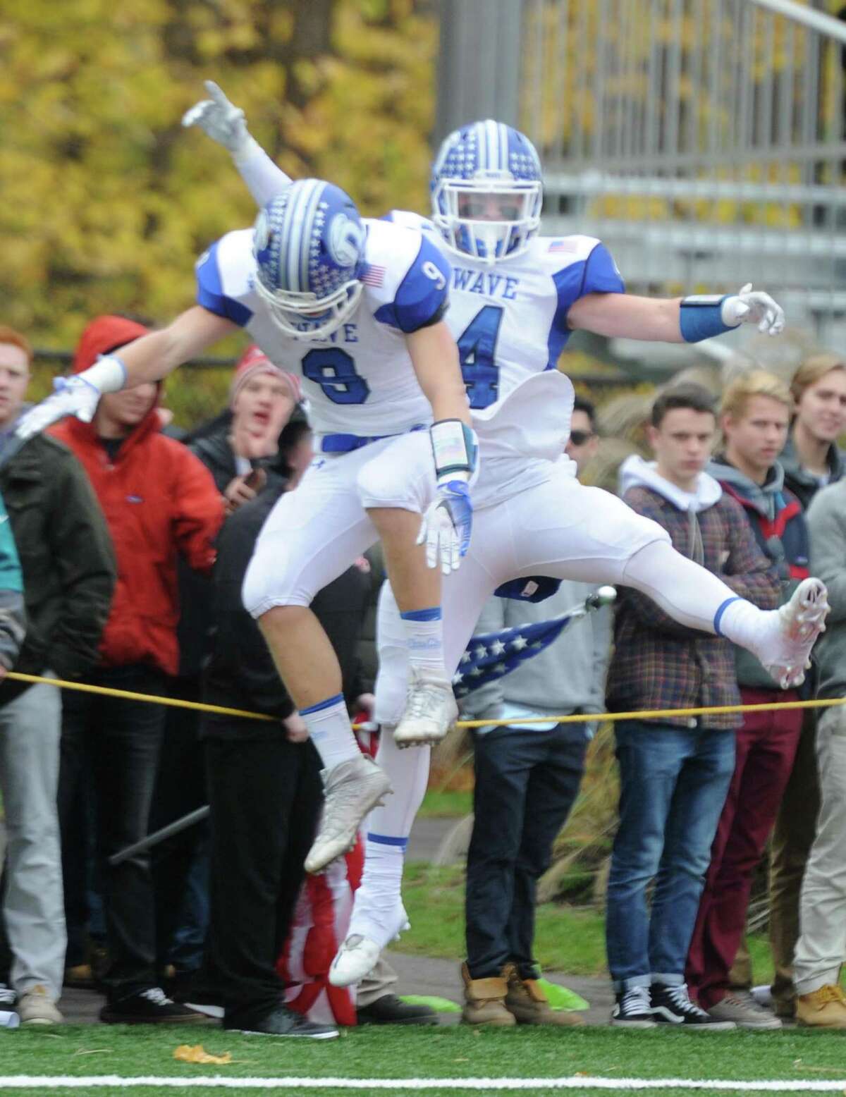 Photos from Darien's 37-34 win over New Canaan in the Turkey Bowl high school football game at Dunning Stadium in New Canaan, Conn. Thursday, Nov. 24, 2016. New Canaan scored 24 unanswered points to tie the game and force an overtime. In overtime, Darien kicked a field goal to take the lead and forced a New Canaan interception to end the game, setting off a wild celebration as fans stormed the field.