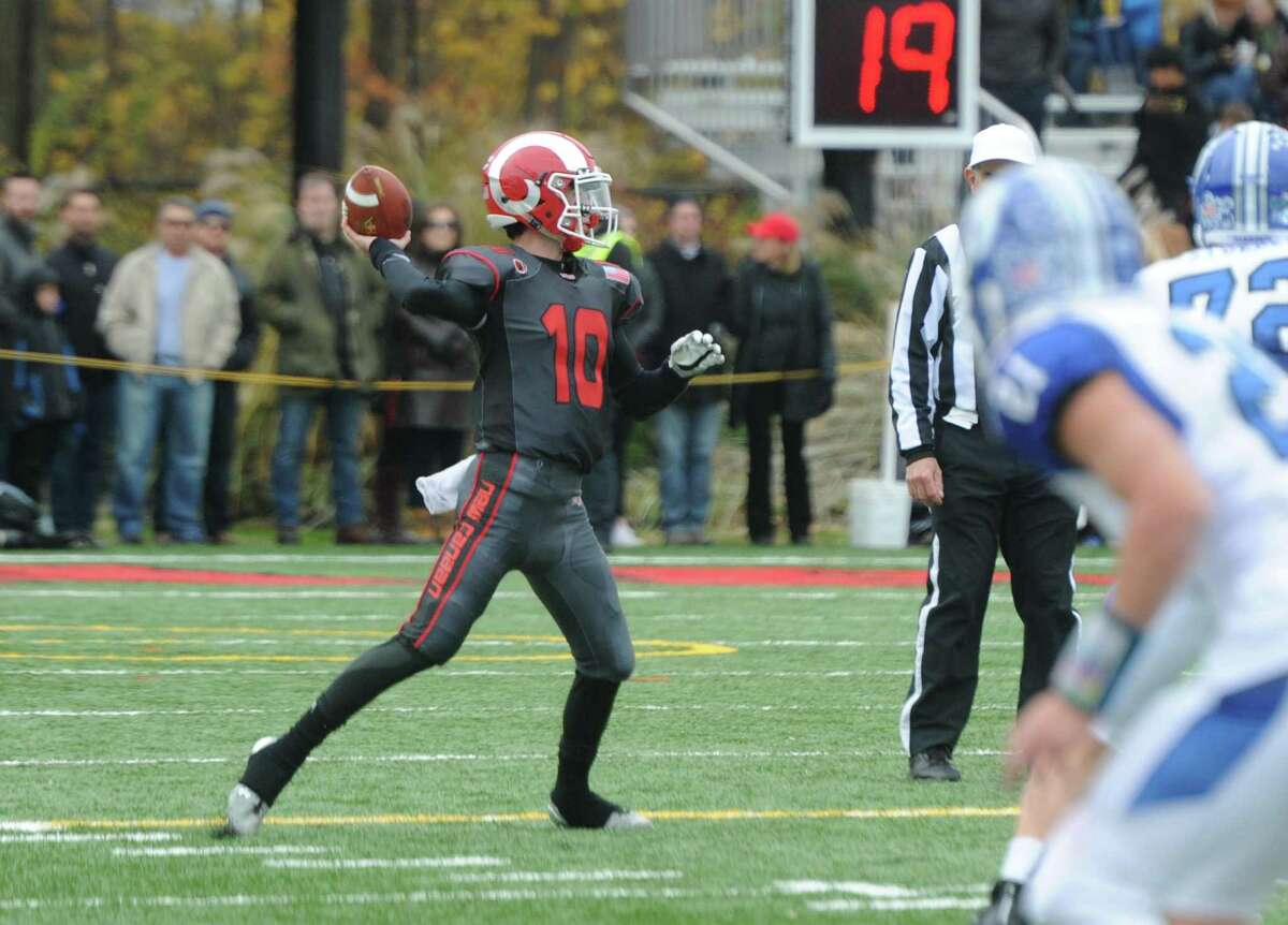 Photos from Darien's 37-34 win over New Canaan in the Turkey Bowl high school football game at Dunning Stadium in New Canaan, Conn. Thursday, Nov. 24, 2016. New Canaan scored 24 unanswered points to tie the game and force an overtime. In overtime, Darien kicked a field goal to take the lead and forced a New Canaan interception to end the game, setting off a wild celebration as fans stormed the field.
