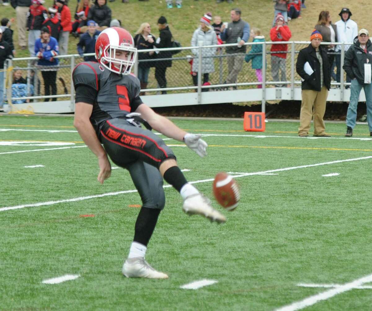 Photos from Darien's 37-34 win over New Canaan in the Turkey Bowl high school football game at Dunning Stadium in New Canaan, Conn. Thursday, Nov. 24, 2016. New Canaan scored 24 unanswered points to tie the game and force an overtime. In overtime, Darien kicked a field goal to take the lead and forced a New Canaan interception to end the game, setting off a wild celebration as fans stormed the field.