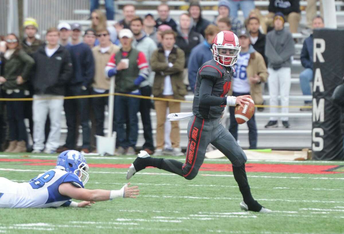 Photos from Darien's 37-34 win over New Canaan in the Turkey Bowl high school football game at Dunning Stadium in New Canaan, Conn. Thursday, Nov. 24, 2016. New Canaan scored 24 unanswered points to tie the game and force an overtime. In overtime, Darien kicked a field goal to take the lead and forced a New Canaan interception to end the game, setting off a wild celebration as fans stormed the field.