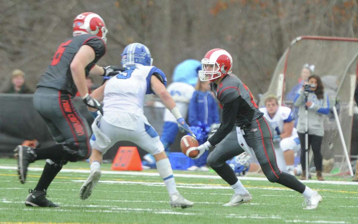 Photos from Darien's 37-34 win over New Canaan in the Turkey Bowl high school football game at Dunning Stadium in New Canaan, Conn. Thursday, Nov. 24, 2016. New Canaan scored 24 unanswered points to tie the game and force an overtime. In overtime, Darien kicked a field goal to take the lead and forced a New Canaan interception to end the game, setting off a wild celebration as fans stormed the field.