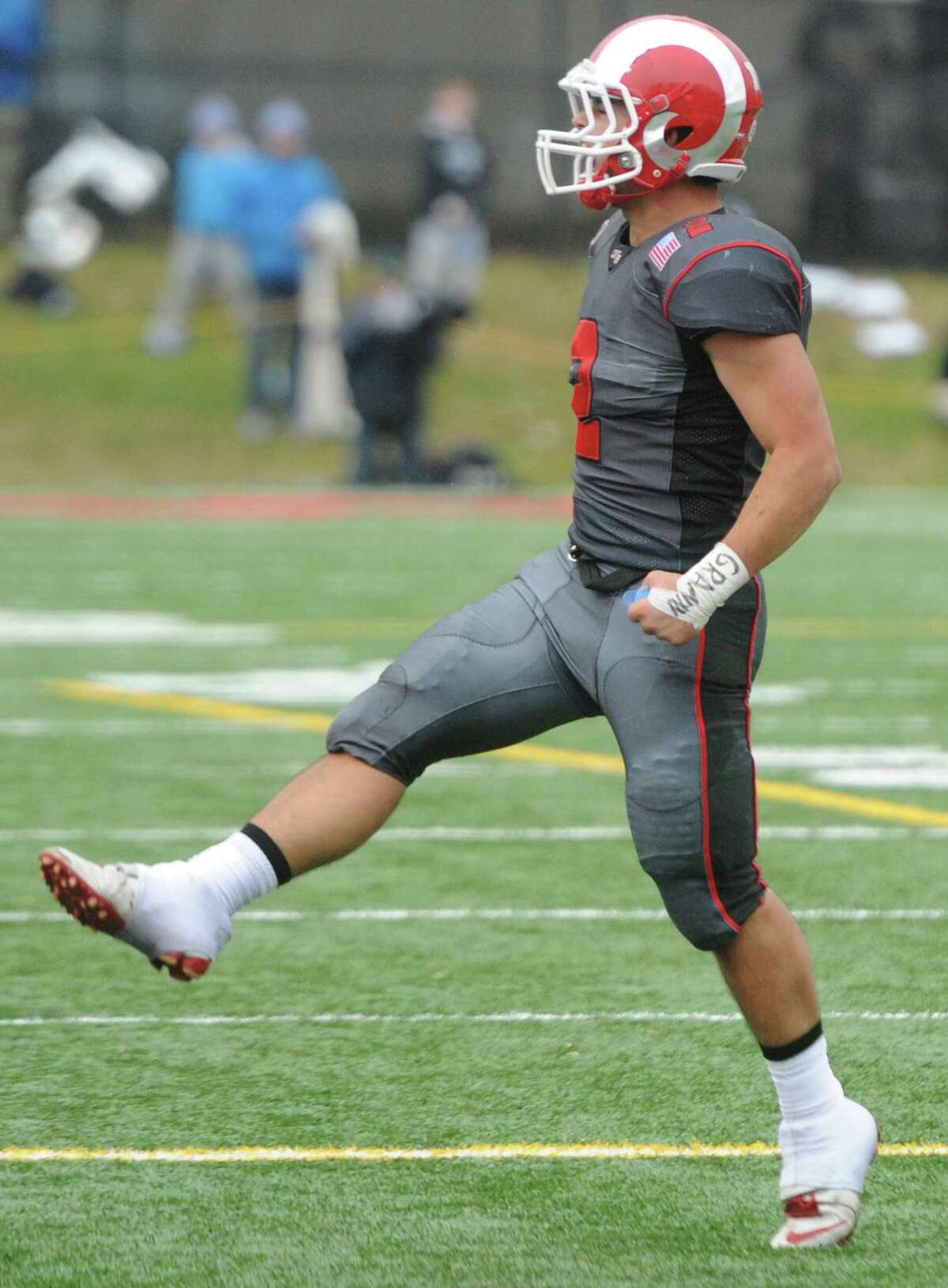 Photos from Darien's 37-34 win over New Canaan in the Turkey Bowl high school football game at Dunning Stadium in New Canaan, Conn. Thursday, Nov. 24, 2016. New Canaan scored 24 unanswered points to tie the game and force an overtime. In overtime, Darien kicked a field goal to take the lead and forced a New Canaan interception to end the game, setting off a wild celebration as fans stormed the field.