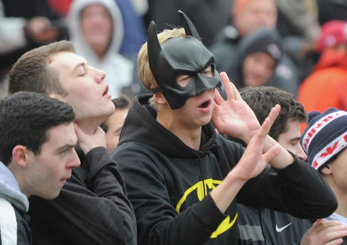 Photos from Darien's 37-34 win over New Canaan in the Turkey Bowl high school football game at Dunning Stadium in New Canaan, Conn. Thursday, Nov. 24, 2016. New Canaan scored 24 unanswered points to tie the game and force an overtime. In overtime, Darien kicked a field goal to take the lead and forced a New Canaan interception to end the game, setting off a wild celebration as fans stormed the field.
