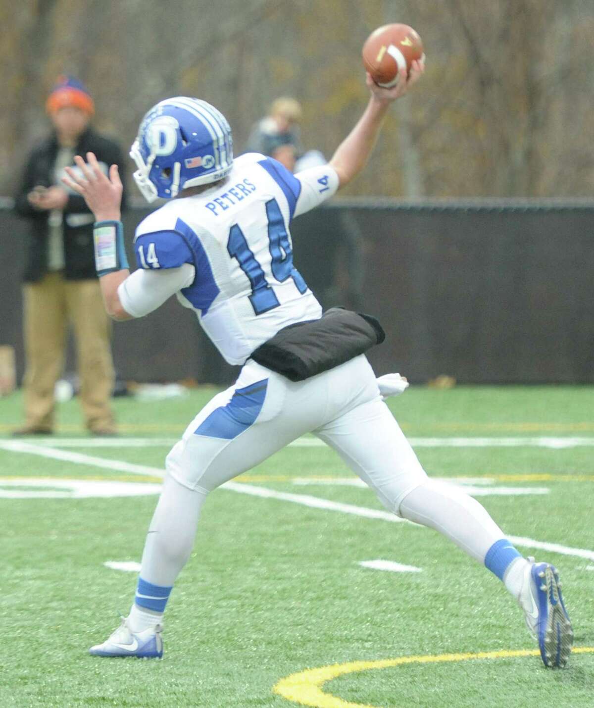 Photos from Darien's 37-34 win over New Canaan in the Turkey Bowl high school football game at Dunning Stadium in New Canaan, Conn. Thursday, Nov. 24, 2016. New Canaan scored 24 unanswered points to tie the game and force an overtime. In overtime, Darien kicked a field goal to take the lead and forced a New Canaan interception to end the game, setting off a wild celebration as fans stormed the field.