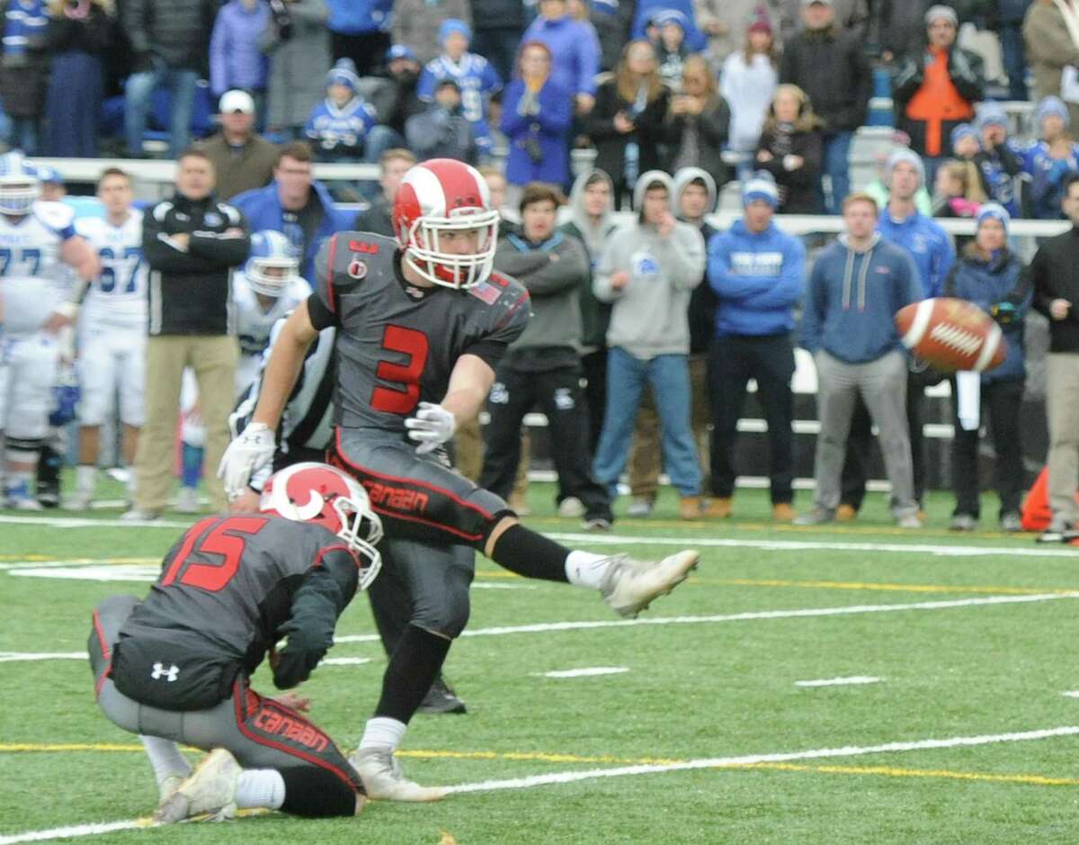 Photos from Darien's 37-34 win over New Canaan in the Turkey Bowl high school football game at Dunning Stadium in New Canaan, Conn. Thursday, Nov. 24, 2016. New Canaan scored 24 unanswered points to tie the game and force an overtime. In overtime, Darien kicked a field goal to take the lead and forced a New Canaan interception to end the game, setting off a wild celebration as fans stormed the field.