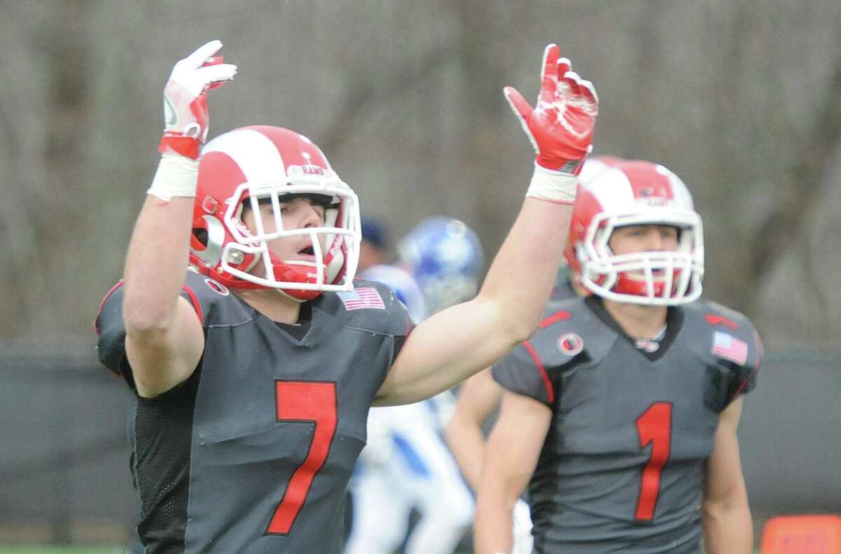 Photos from Darien's 37-34 win over New Canaan in the Turkey Bowl high school football game at Dunning Stadium in New Canaan, Conn. Thursday, Nov. 24, 2016. New Canaan scored 24 unanswered points to tie the game and force an overtime. In overtime, Darien kicked a field goal to take the lead and forced a New Canaan interception to end the game, setting off a wild celebration as fans stormed the field.